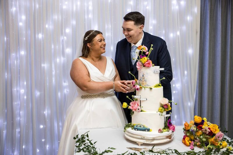 Stephanie Cotter and Ryan Ahern cut their wedding cake.