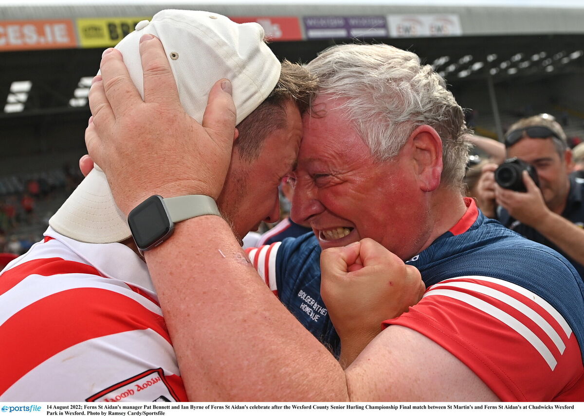 Ferns St Aidan's manager Pat Bennett and Ian Byrne of Ferns St Aidan's celebrate after their Wexford county success in 2022. Picture: Ramsey Cardy/Sportsfile