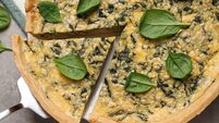 Delicious homemade spinach pie and spatula on grey table, top view