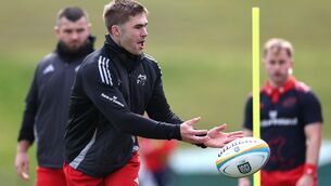 <p>Jack Crowley is put through his paces during Munster training at UL. Pic: INPHO/James Crombie</p>