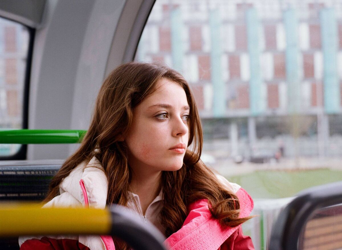 Caoimhe on the bus, 2025, from the series Nothing Lasts Forever – Youth of Ballymun, by photographer Laura Dunwoody. It features in the Taylor Wessing Irish Photo Prize exhibition at Photo Museum Ireland, Dublin