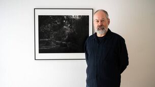 <p>Artist Conor Horgan, winner of the inaugural Taylor Wessing Irish Photo Prize, pictured with his work EDGE at Photo Museum Ireland. </p>