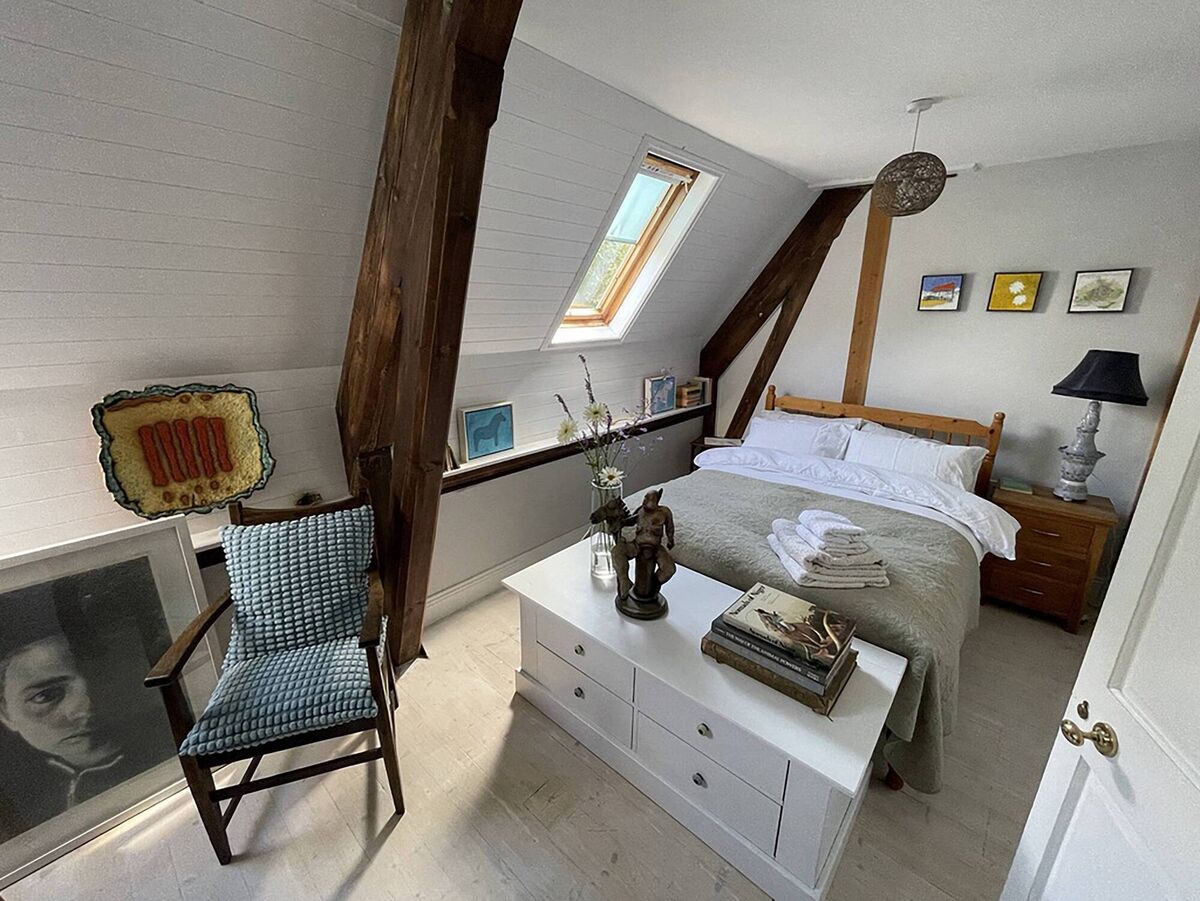 The sunny south side of the residence: Sleeping quarters above the gallery.