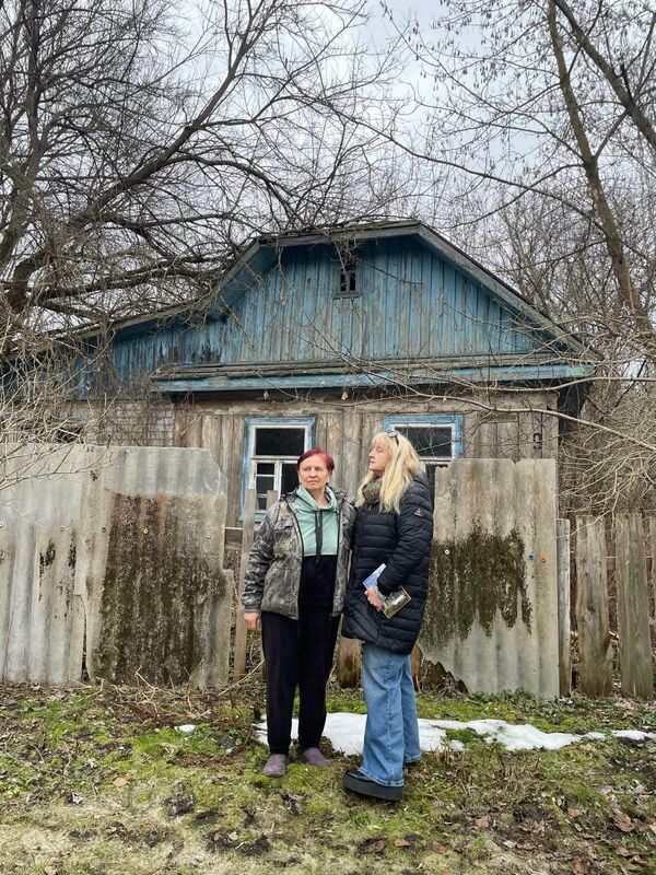 Maria Verbych (left) with Fiona Corcoran (right), outside her family home in Chornobyl. Maria describes the memory of the nuclear disaster as 'like a horror film' in which a once vibrant town became deserted overnight. Maria Verbych (left) with Fiona Corcoran (right), outside her family home in Chornobyl. Maria describes the memory of the nuclear disaster as 'like a horror film' in which a once vibrant town became deserted overnight.