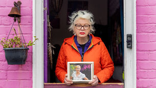 <p>Deirdre McLaughlin holds a picture of her sister, Siobhán Kearney, at her home in Dalkey, Dublin. Picture: Gareth Chaney</p>