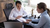 Female legal advisor lawyer helping her client with her legal issues in the office