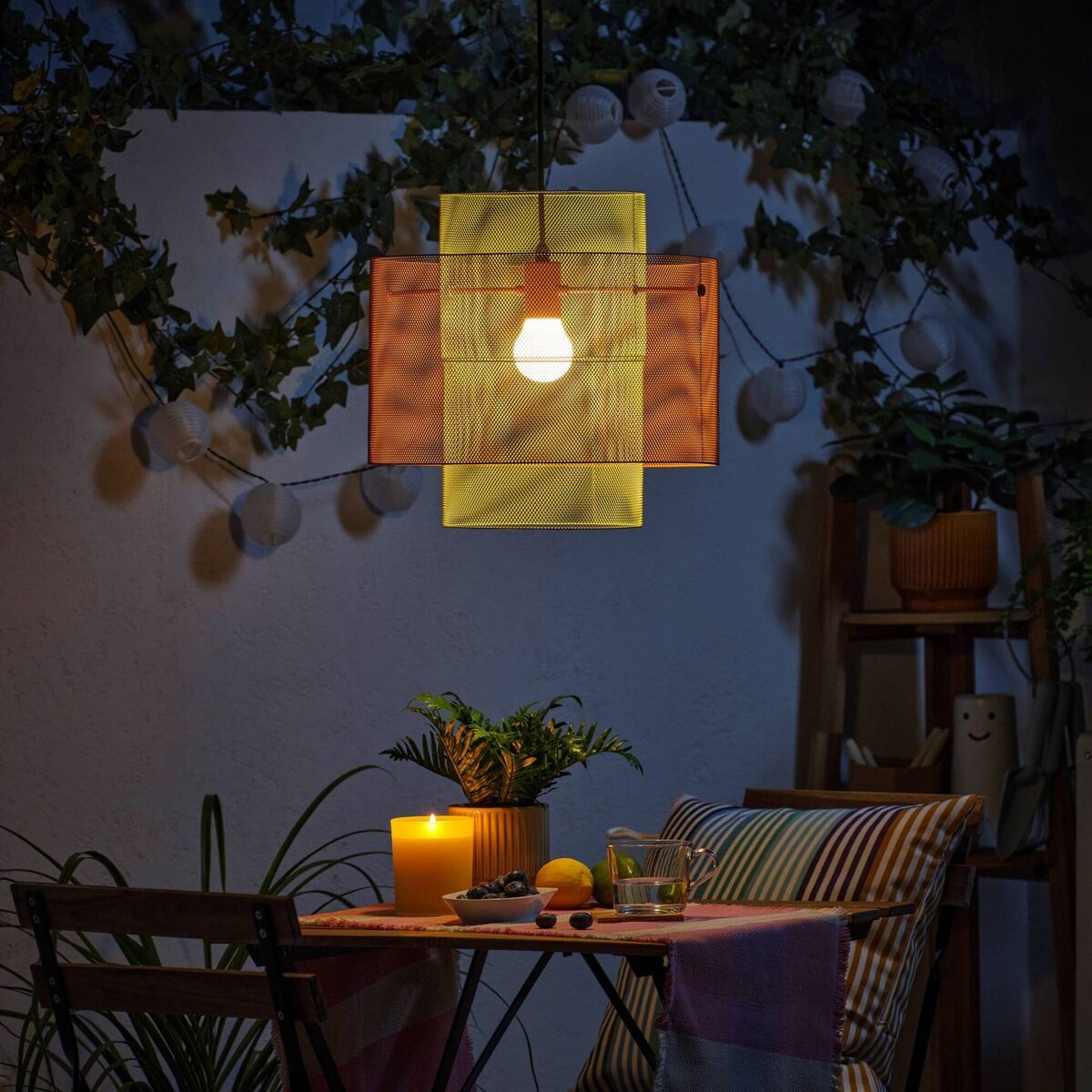 This affordable Ikea Solviden ceiling light, €29, in powdered steel is a scene-stealer for a protected patio or garden room. It has an avant-garde double drum profile, with a mesh housing that not only distils and gentles illumination, but casts fascinating, shifting patterns of light and shadow play on nearly surfaces. Hung from a hook, it has an LED light source and an it's ideal for sheltered porched areas with an IP44 splash-proof rating.