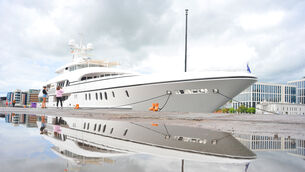 <p> Reflection of the Superyacht Bella Vita at Kennedy Quay, Cork City on Thursday afternoon as UCC students Lauren Moloney, from Tipperary and Mairead Lehane, from Kerry get close for a look. Pic: Larry Cummins</p>