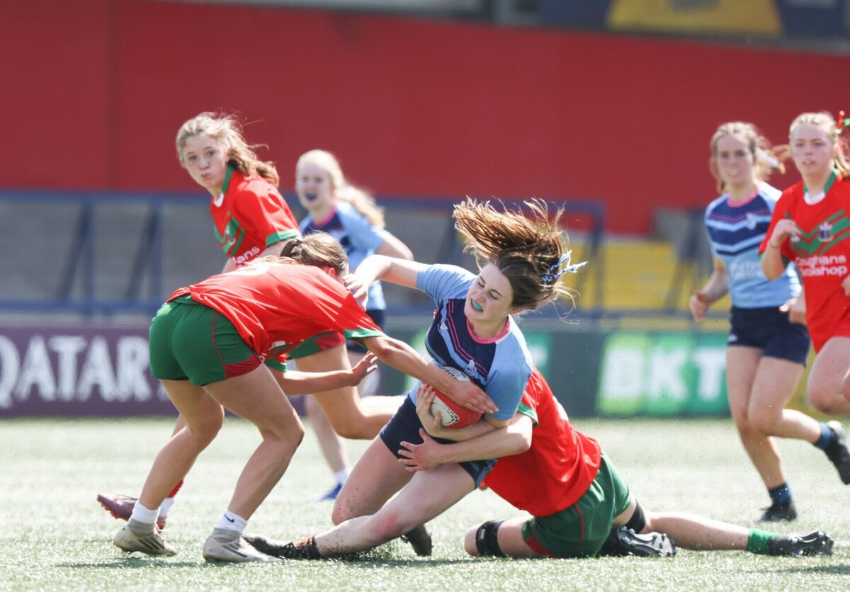 CPB’s Niamh O'Sullivan is tackled by Aoife Walsh and Emer O'Connor of Sacred Heart Clonakilty. Pic: ©INPHO/Tom Maher