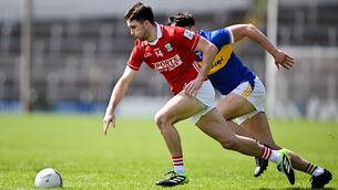 <p>Chris Óg Jones of Cork in action against Mark Corcoran of Tipperary. Pic: Sam Barnes/Sportsfile</p>