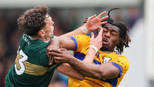 <p>David Clifford of Kerry fouls Ikem Ugwueru of Clare. Pic: Natasha Barton/Inpho</p>
