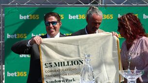 <p>READ IT: Trainer Dan Skelton celebrates after becoming the first trainer to surpass £5 million in prize money in a season at Sandown Park Racecourse. Pic: Steven Paston/PA Wire</p>