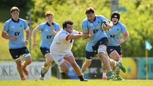 <p>Paul Gerard of UCD RFC is tackled by Arthur O'Rahilly of Dublin University FC. Pic: Matt Browne/Sportsfile</p>