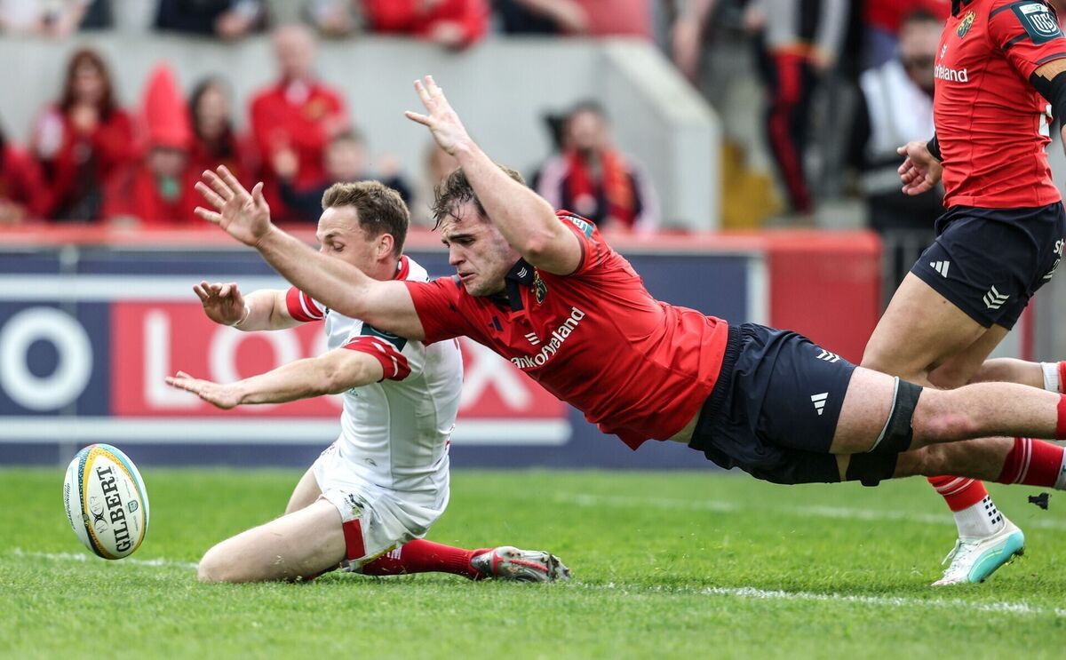 Munster's Alex Kendellen scores his side's seventh try of the match despite Ulster's James Humpreys. Pic: Dan Sheridan/Inpho