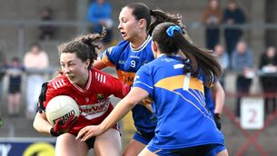 <p>FIGHTING FOR INCHES: Abbie O'Mahony with possession in midfield comes under pressure from Niamh Martin and Sarah English, of Tipperary in the TG4 Munster LGFA Senior Championship Round 1 game at Pairc Ui Rinn. Cork vs Tipperary. Pic: Larry Cummins</p>