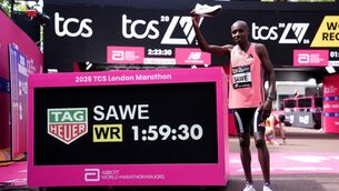<p>Sabastian Sawe next to the timer after setting a new world record during the 2026 TCS London Marathon. Pic: John Walton/PA Wire.</p>