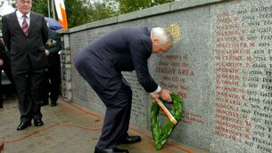 <p>Then taoiseach Bertie Ahern laying a wreath following the unveiling of the first World War memorial in Fermoy. Picture: Richard Mills.</p>