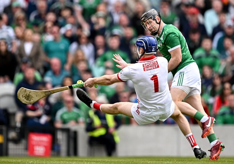 Cork goalkeeper Patrick Collins saves a shot from Limerick's Peter Casey. Pic: Seb Daly/Sportsfile