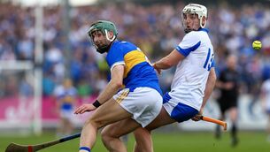 <p>Waterford's Dessie Hutchinson and Tipperary's Robert Doyle. Pic: INPHO</p>