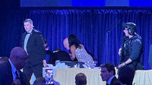 US Secret Service agents surround President Donald Trump (Mark Schiefelbein/AP)