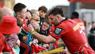 <p>Munster's John Hodnett signs autographs after the match. Pic: Dan Sheridan/Inpho</p>