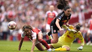 <p>BIG BATTLE: Arsenal's Olivia Smith (left) claims the ball before scoring their side's second of the game during the UEFA Women's Champions League semi-final, first leg match at the Emirates Stadium, London. Pic: Andrew Matthews/PA Wire.</p>