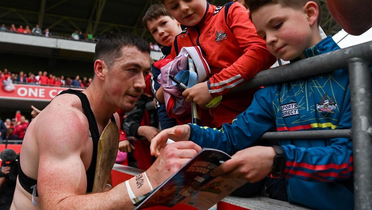 SIGNATURE PERFORMANCE: Seán O'Donoghue signs the match programme of a young supporter. Pic: Tom Beary/Sportsfile