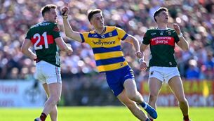 <p>DESTROYED: Roscommon's Dylan Ruane celebrates scoring a point, as Mayo players Matthew Ruane and Conor Loftus look on. Pic: Piaras Ó Mídheach/Sportsfile.</p>