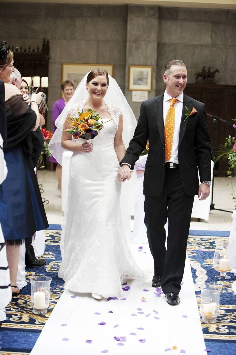 Caroline Downey and Barry walk down the aisle. 'My dress was what I would call a timeless dress.'