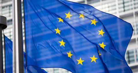 EU flag in front of Berlaymont building facade