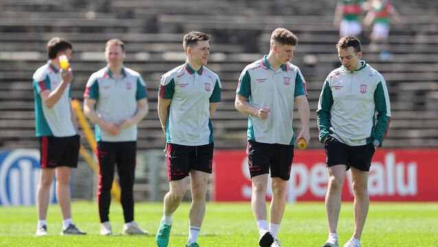 <p>Mayo players chat while inspecting the pitch. Pic: Tom O’Hanlon/Inpho</p>