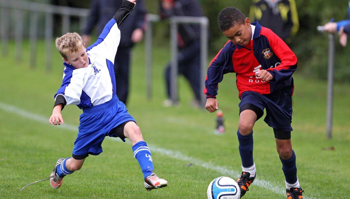 Tyreik Wright in action for Lakewood Athletic, against Killian Coffey, Leeds. Pic: Jim Coughlan.