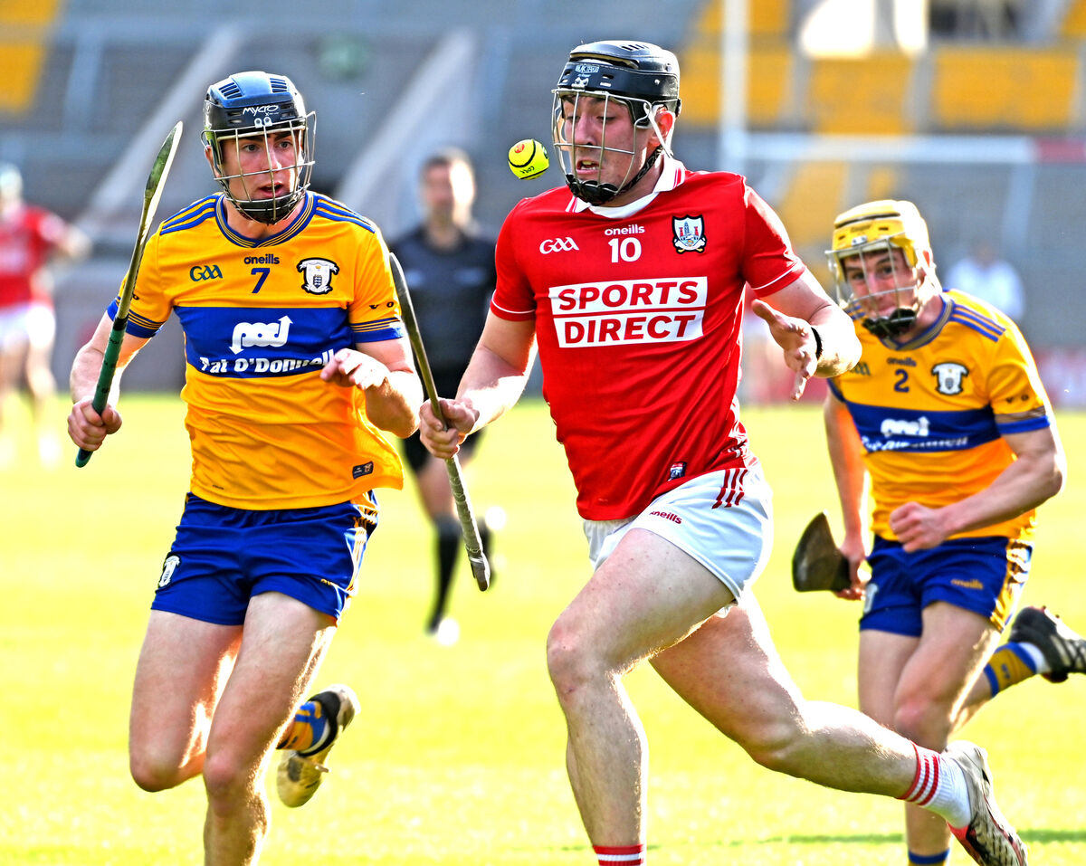 Cork's Zach Biggane racing on to the sliotar from Clare's Matthew O'Halloran and Jamie Moylan. Pic: Eddie O'Hare. Cork's Zach Biggane racing on to the sliotar from Clare's Matthew O'Halloran and Jamie Moylan. Pic: Eddie O'Hare.
