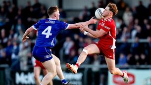 <p>Monaghan's Martin Quinn intercepts the ball from Shea McDermott of Tyrone with his finger tip. Pic: ©INPHO/Nick Elliott.</p>