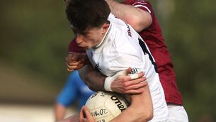 <p>Kildare's Jimmy Lynch is tackled. Pic: ©INPHO/Bryan Keane.</p>