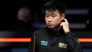 <p>Zhao Xintong reacts after playing a shot during his quarter final match against Shaun Murphy, on day twelve of the Halo World Snooker Championship 2026 at the Crucible Theatre. Pic: Martin Rickett/PA Wire.</p>