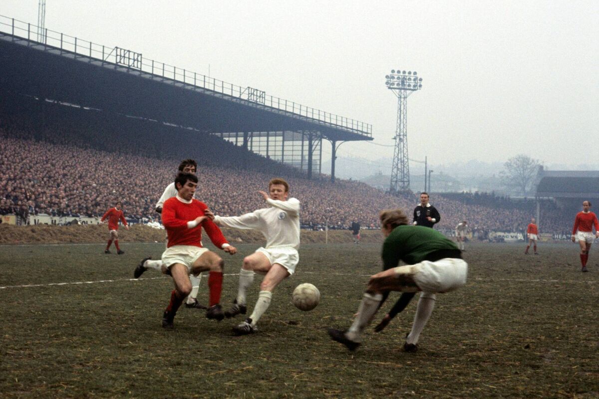Leeds United powerhouse Billy Bremner battling Man United and Ireland's Tony Dunne.