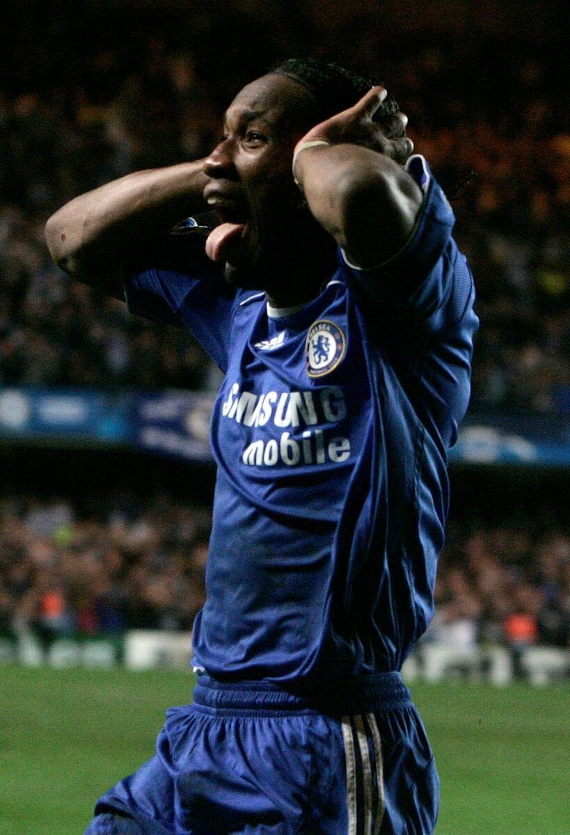 Chelsea's Didier Drogba celebrates scoring against Liverpool in 2008. Picture: AP Photo/Alastair Grant