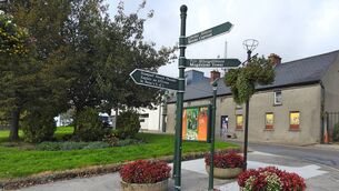 <p>Directional signage in Drogheda town centre in the Irish language, translated directly into English.</p>