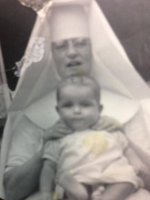 Michael McKeirnan with Sister Cyril, a family friend who accompanied him on his flight to New York to his adoptive family