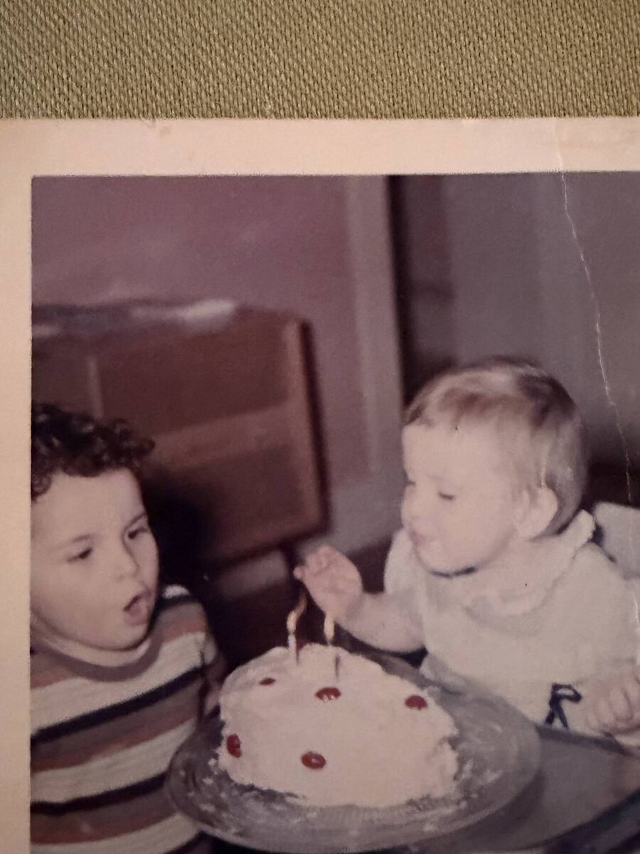 Mike and Angela: Angela is blowing out the birthday candles. It is her second birthday and the photo was taken at her adoptive home in Washington State.