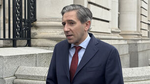 <p>Tanaiste Simon Harris said it was by ‘the grace of God’ no one was hurt after a child fired a gun in Ballymun, Dublin on Tuesday (Bairbre Holmes/PA)</p>