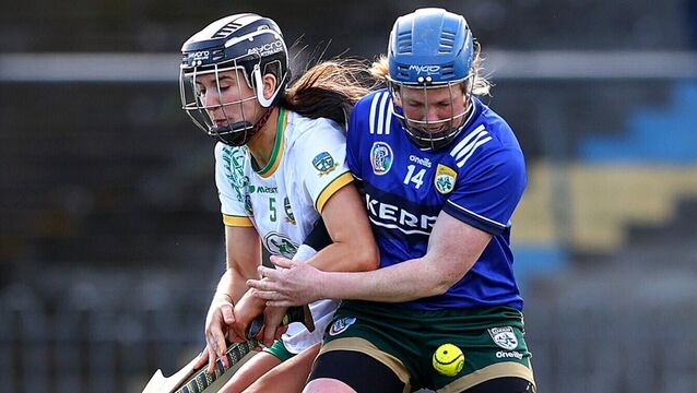 <p>FOCUSED: Meath's Leah Devine with Laura Collins of Kerry keep their eyes on the sliotar. Picture: INPHO/Tom O’Hanlon</p>