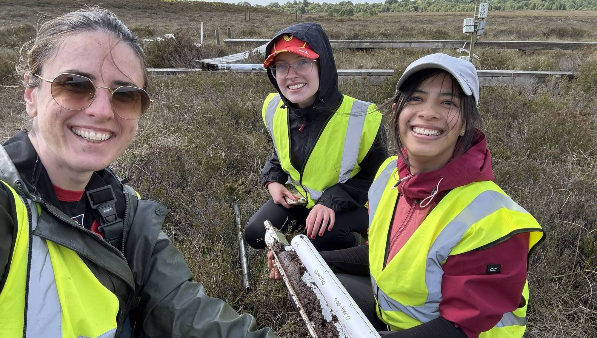 Michelle McKeown, Leanne ODonoghue, and Xyza Vasily Dela Pena explore the peatlands at Clara Bog, Co Offaly.