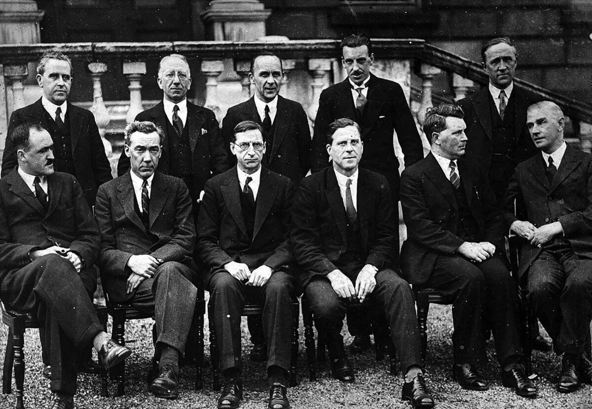 The first Fianna Fáil cabinet in 1932. Standing left to right: Seán MacEntee, Seán T. O’Kelly, Joseph Connolly, Seán Lemass, Gerald Boland. Sitting left to right: Frank Aiken, P.J. Ruttledge, Éamon de Valera, James Ryan, Thomas Derrig, James Geoghegan. The first Fianna Fáil cabinet in 1932. Standing left to right: Seán MacEntee, Seán T. O’Kelly, Joseph Connolly, Seán Lemass, Gerald Boland. Sitting left to right: Frank Aiken, P.J. Ruttledge, Éamon de Valera, James Ryan, Thomas Derrig, James Geoghegan.