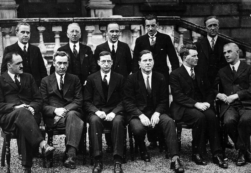 The first Fianna Fáil cabinet in 1932. Standing left to right: Seán MacEntee, Seán T. O’Kelly, Joseph Connolly, Seán Lemass, Gerald Boland. Sitting left to right: Frank Aiken, P.J. Ruttledge, Éamon de Valera, James Ryan, Thomas Derrig, James Geoghegan. The first Fianna Fáil cabinet in 1932. Standing left to right: Seán MacEntee, Seán T. O’Kelly, Joseph Connolly, Seán Lemass, Gerald Boland. Sitting left to right: Frank Aiken, P.J. Ruttledge, Éamon de Valera, James Ryan, Thomas Derrig, James Geoghegan.