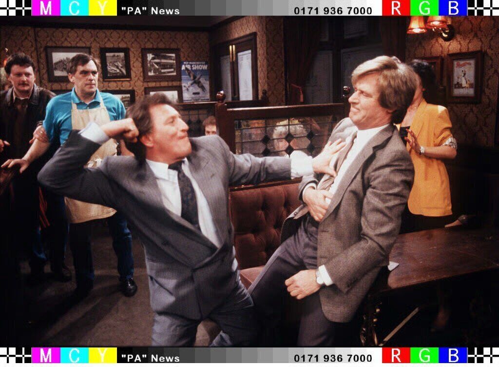 Mike Baldwin (Johnny Briggs) and Ken Barlow (Bill Roache) in Coronation Street. Mike Baldwin (Johnny Briggs) and Ken Barlow (Bill Roache) in Coronation Street.