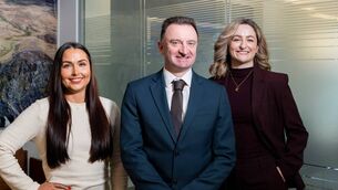 <p>New roles at O’Flynn Exhams: Amy Horgan, Micheál Ó Mulláin, managing partner, and Kathryn Buckley. </p>