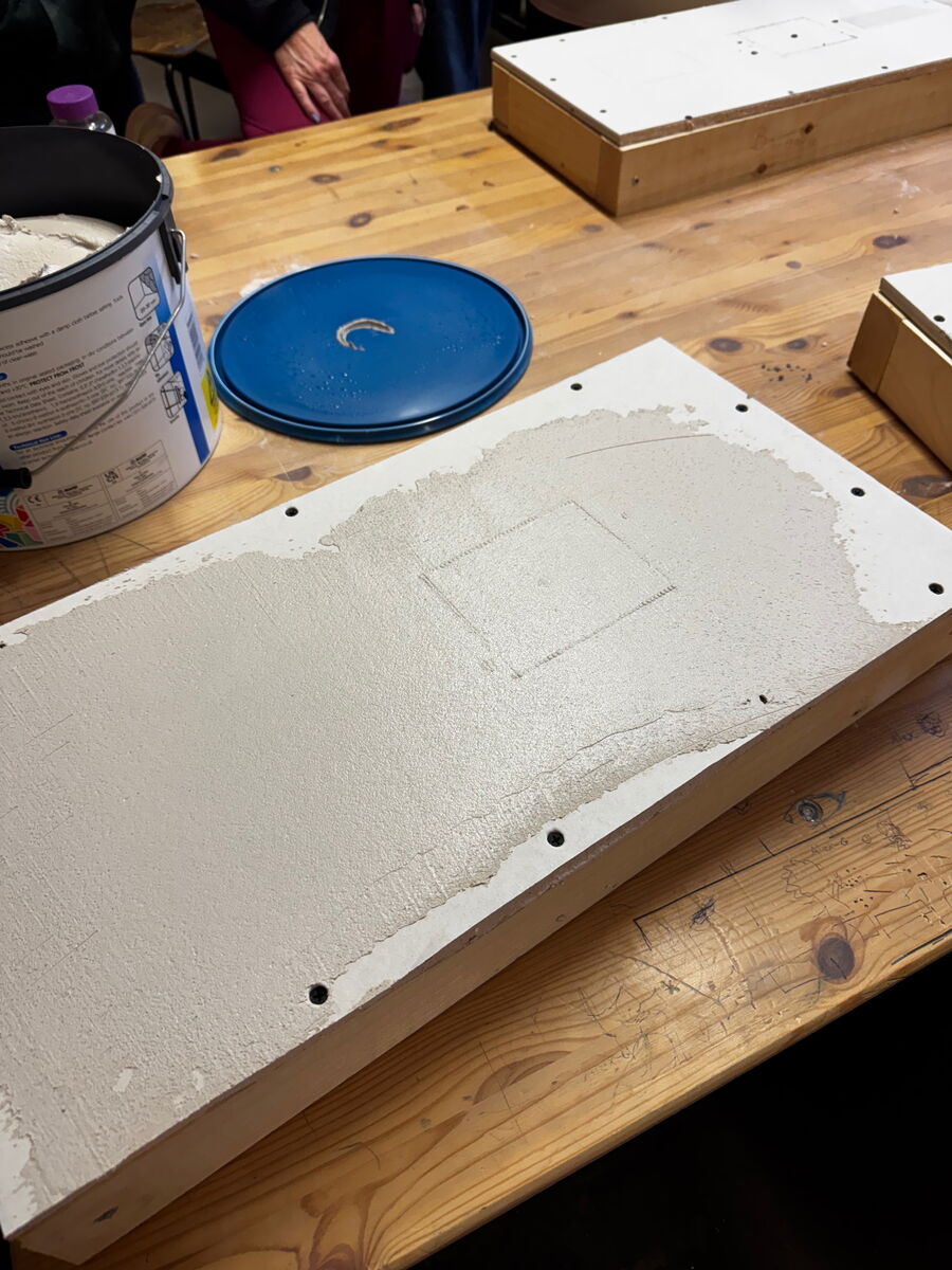 A layer of plaster skimmed over a wall repair.