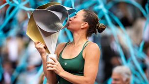 <p>GOLDEN MOMENT: Marta Kostyuk of Ukraine poses with the champions trophy after defeating Mirra Andreeva in the singles final on Day Thirteen of the Mutua Madrid Open at La Caja Magica on May 02, 2026 in Madrid, Spain (Photo by Robert Prange/Getty Images)</p>